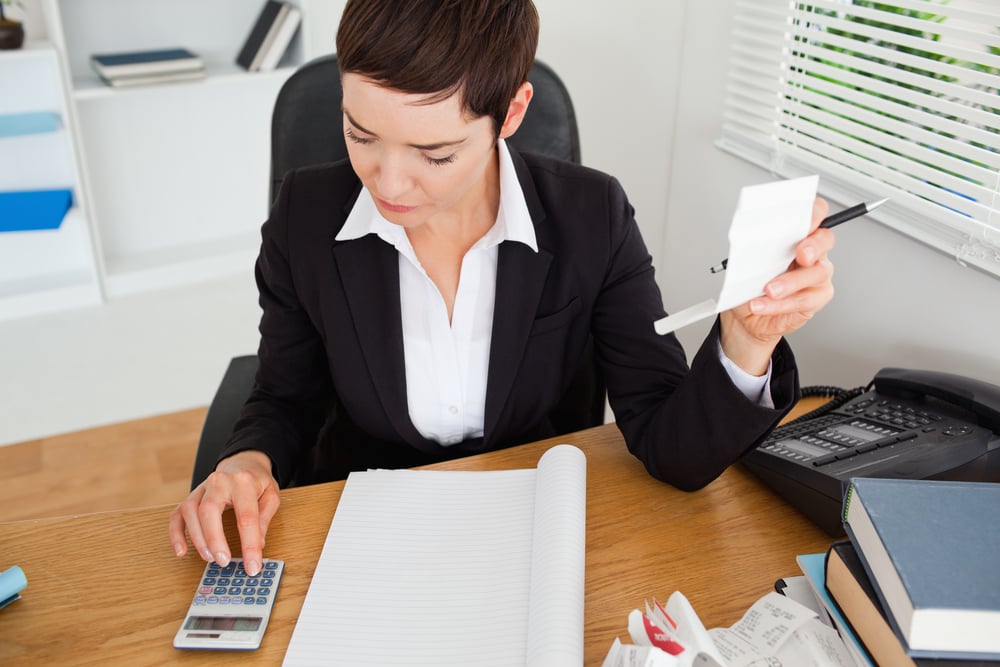 digital-solutions.post.chhubfsLinkedInActive accountant checking receipts in her office